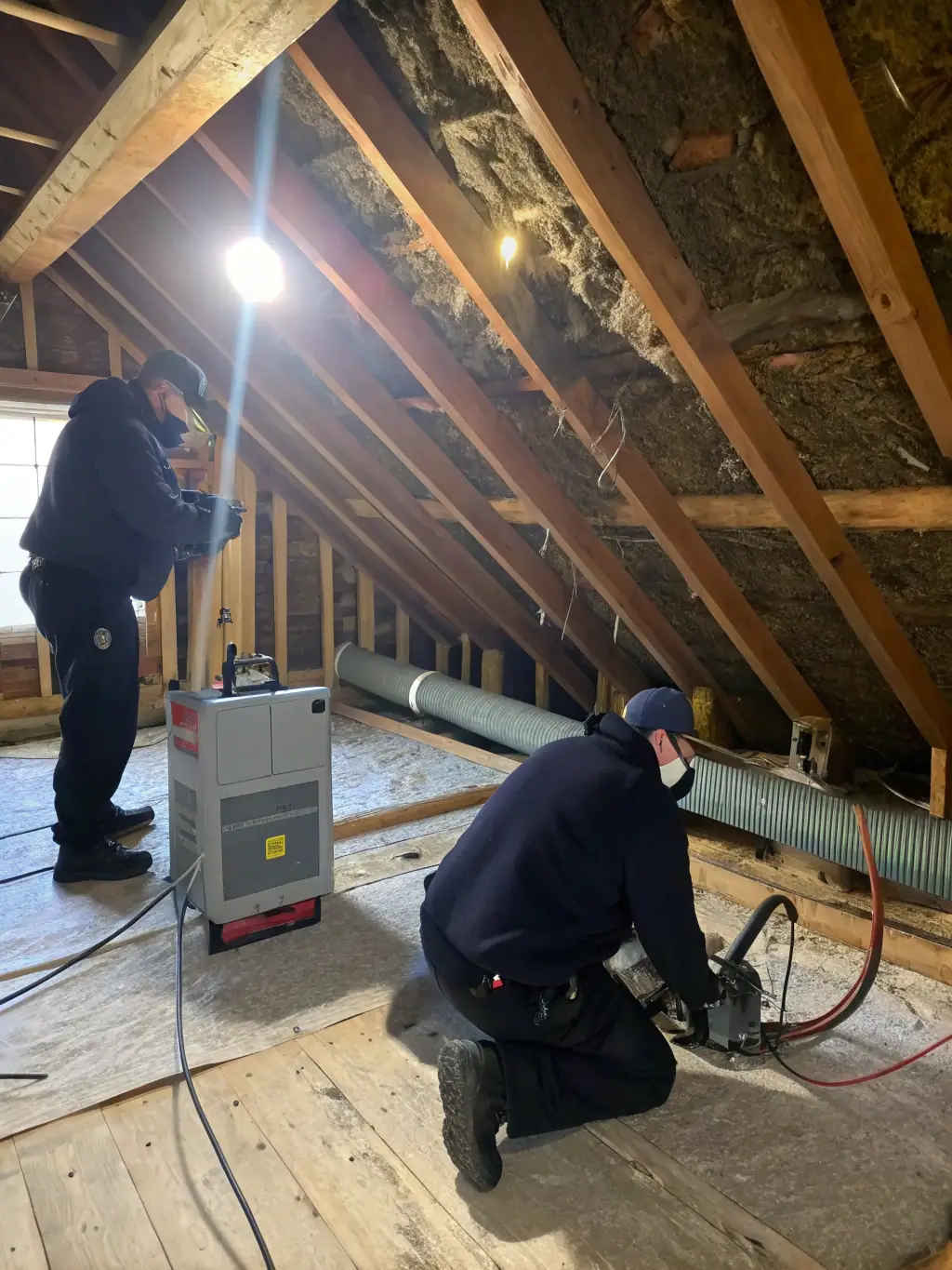 A technician inspecting a crawl space for moisture and mold, highlighting the importance of regular inspections.